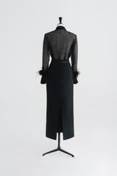High-waisted textured skirt with back slit and sleek tailored silhouette